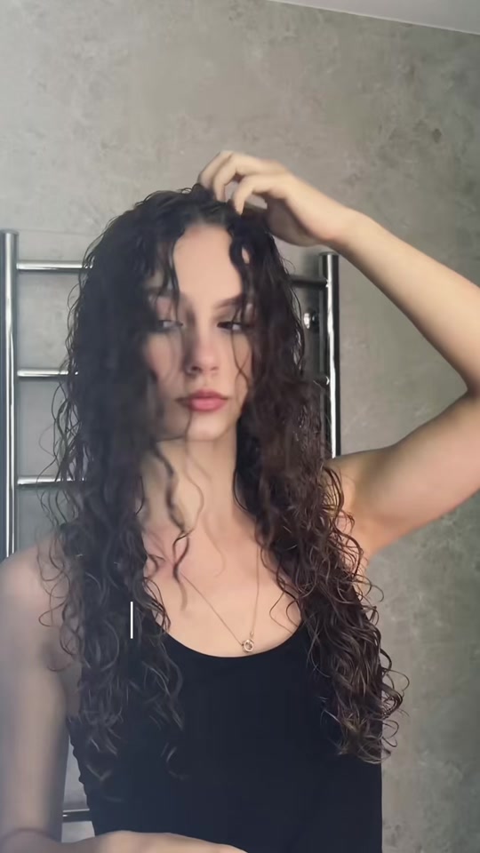 Still from Cutie Lina’s TikTok video about curly hair